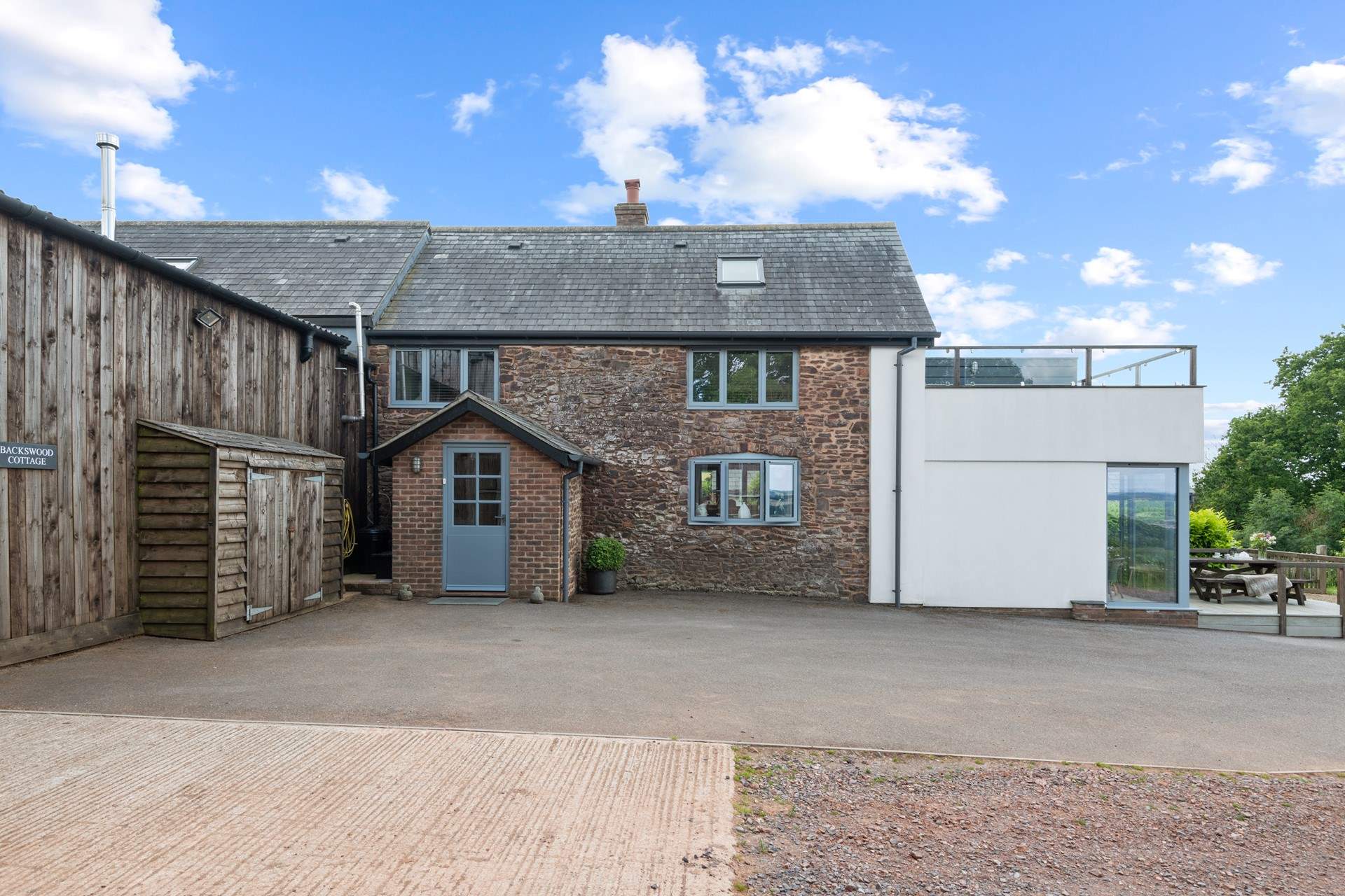 Oodles of parking within the designated courtyard for Backswood Cottage.