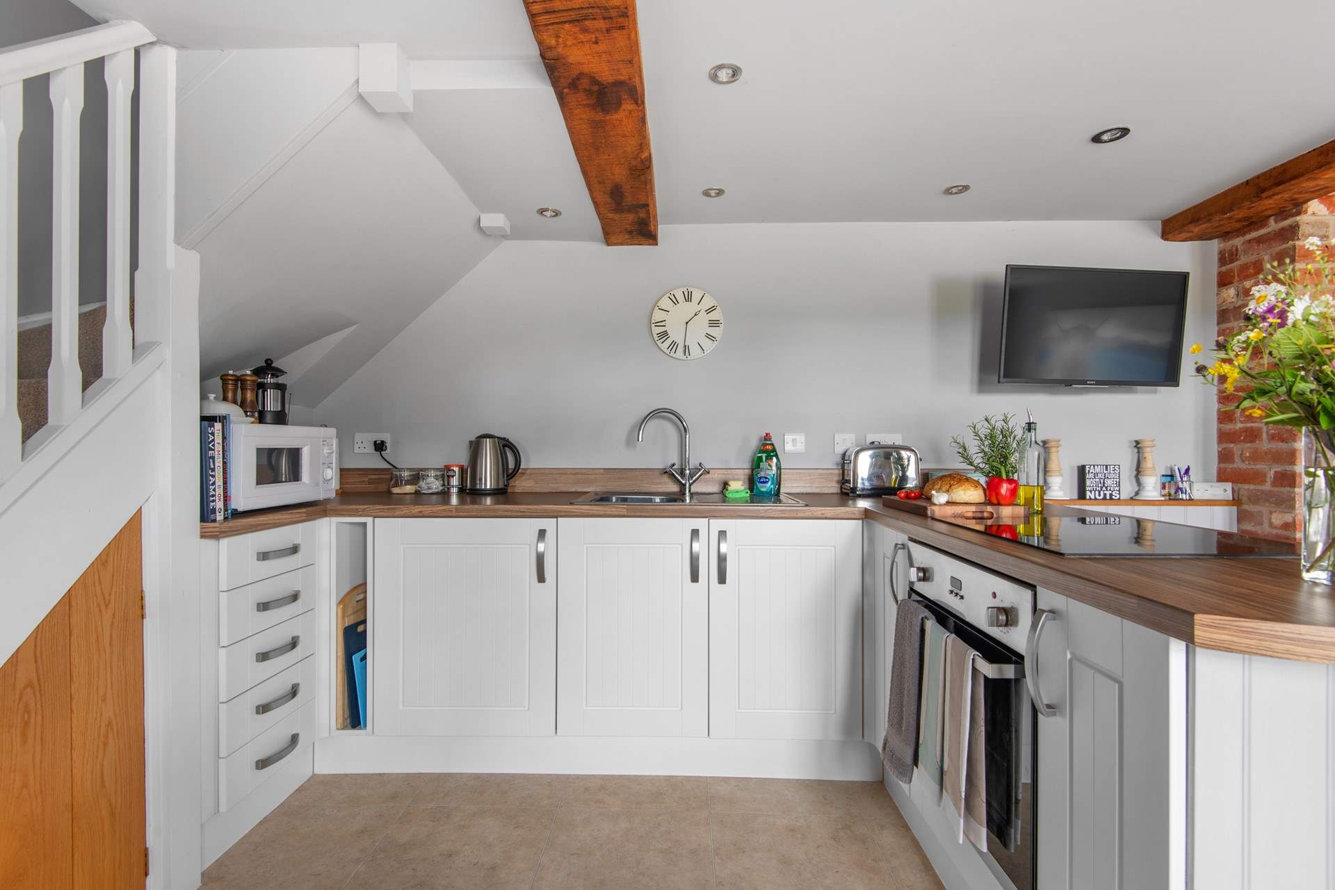 The fully equipped kitchen is perfect for whipping up that special meal for two.