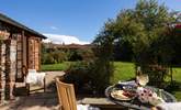 Al fresco dining in the large garden. - Thumbnail Image