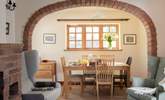 The brick arch perfectly frames the dining-table and the view to the garden. - Thumbnail Image