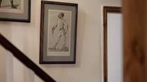 The walls up the stairs are lined with fantastic pictures.