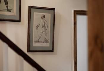 The walls up the stairs are lined with fantastic pictures.
