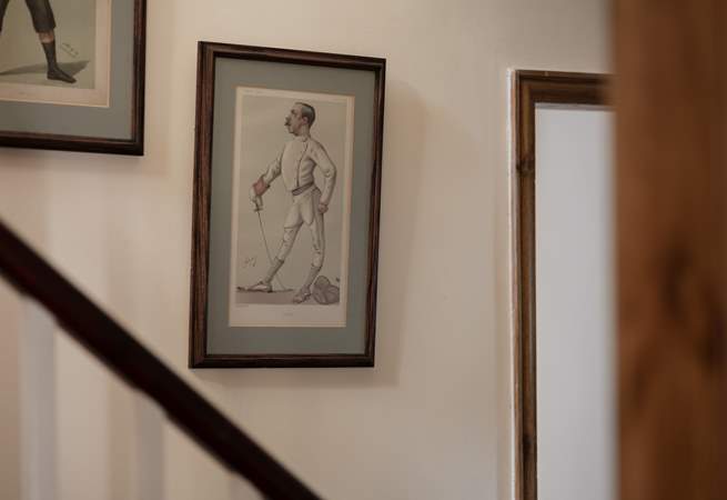 The walls up the stairs are lined with fantastic pictures.