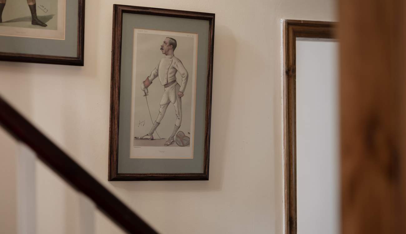 The walls up the stairs are lined with fantastic pictures.