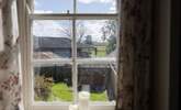 The view into the garden and over to the farmland beyond. - Thumbnail Image