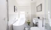 The sumptuous family bathroom has everything you need to relax after a day by the sea. - Thumbnail Image