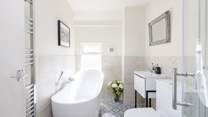 The sumptuous family bathroom has everything you need to relax after a day by the sea.