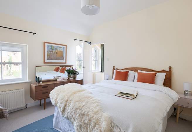 Another bright and airy bedroom with king-size double bed and more original windows.