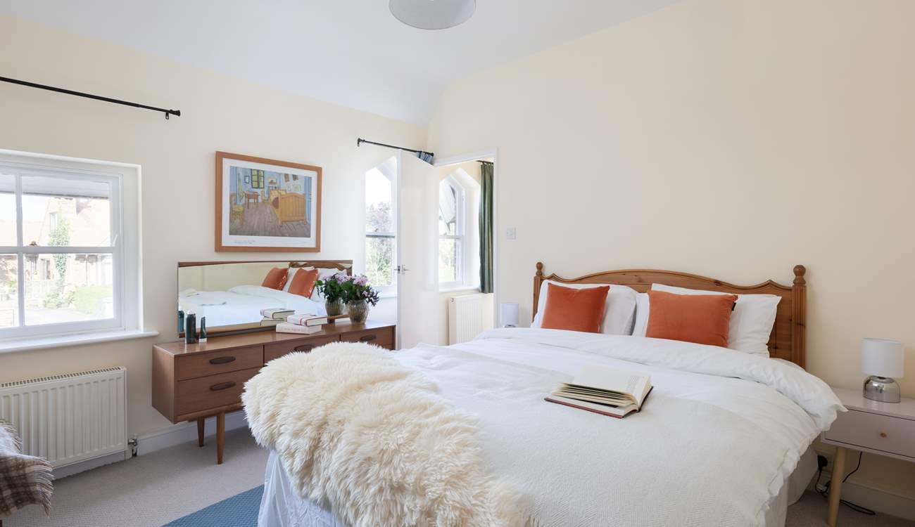 Another bright and airy bedroom with king-size double bed and more original windows.