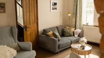 The cosy sitting room is the perfect place to retreat to at the end of the day.