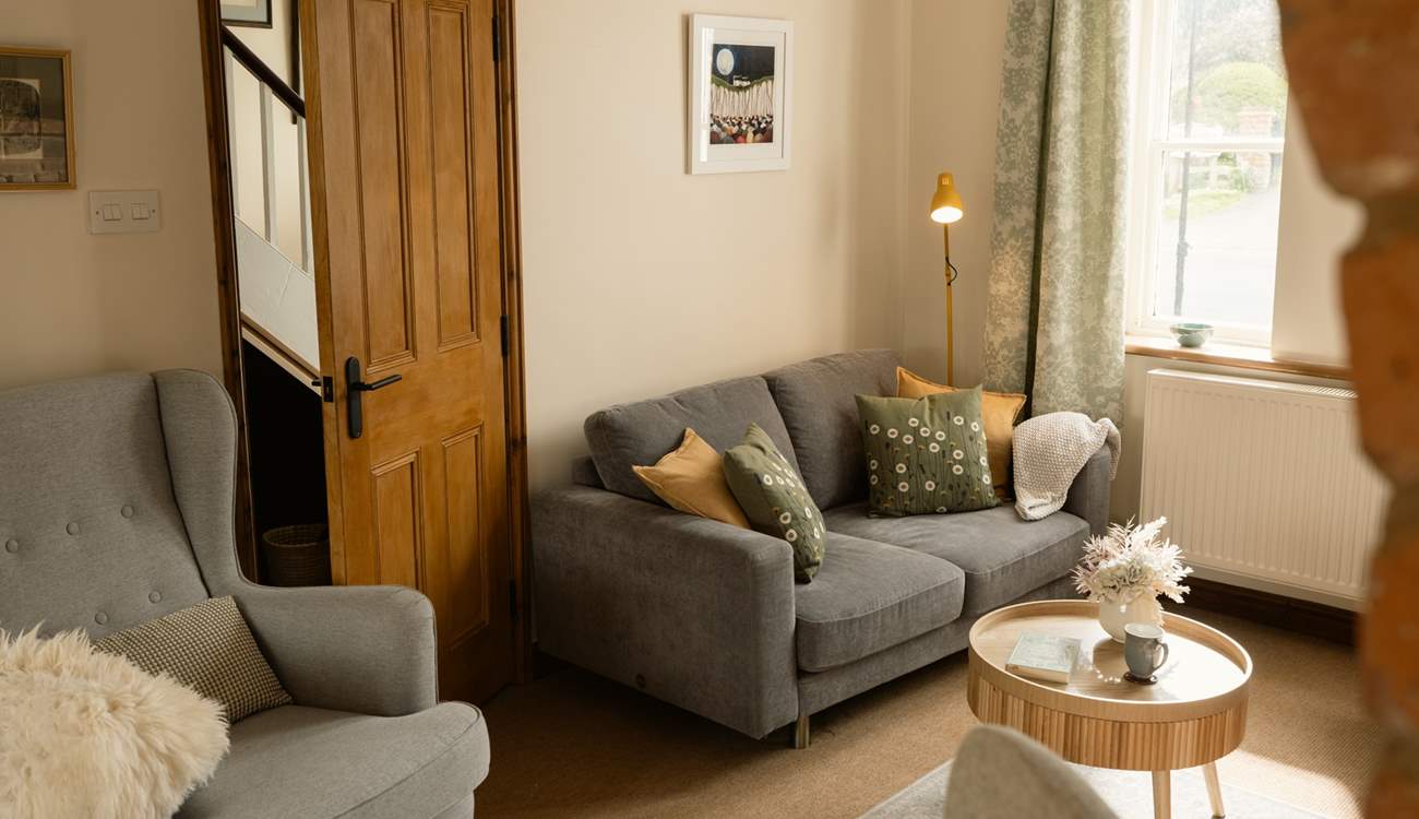 The cosy sitting room is the perfect place to retreat to at the end of the day.