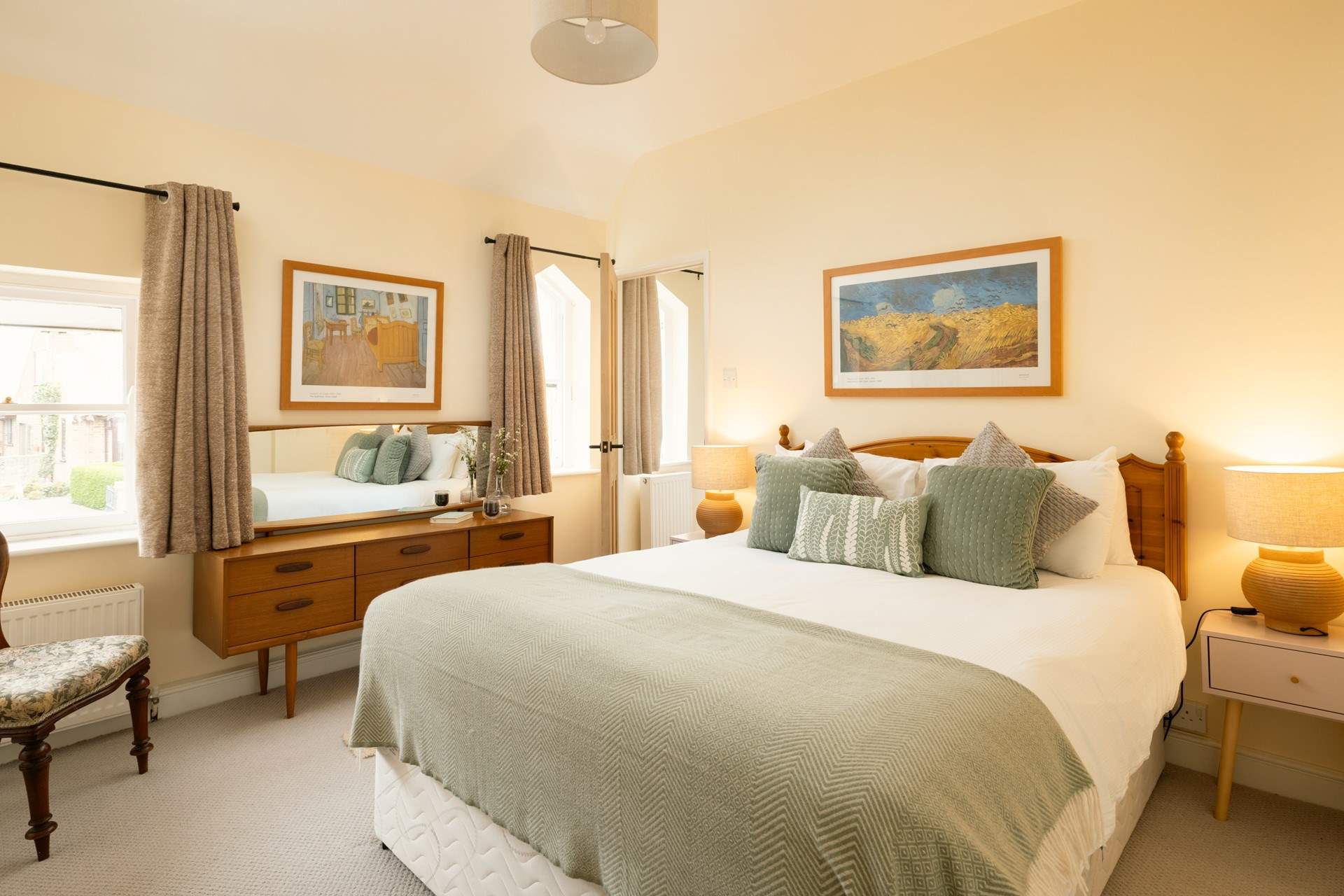 Another bright and airy bedroom with king-size double bed and more original windows.
