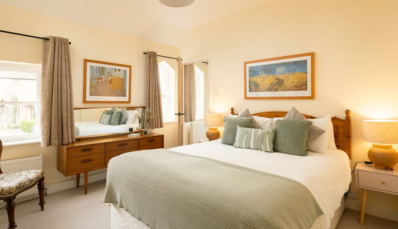 Another bright and airy bedroom with king-size double bed and more original windows.