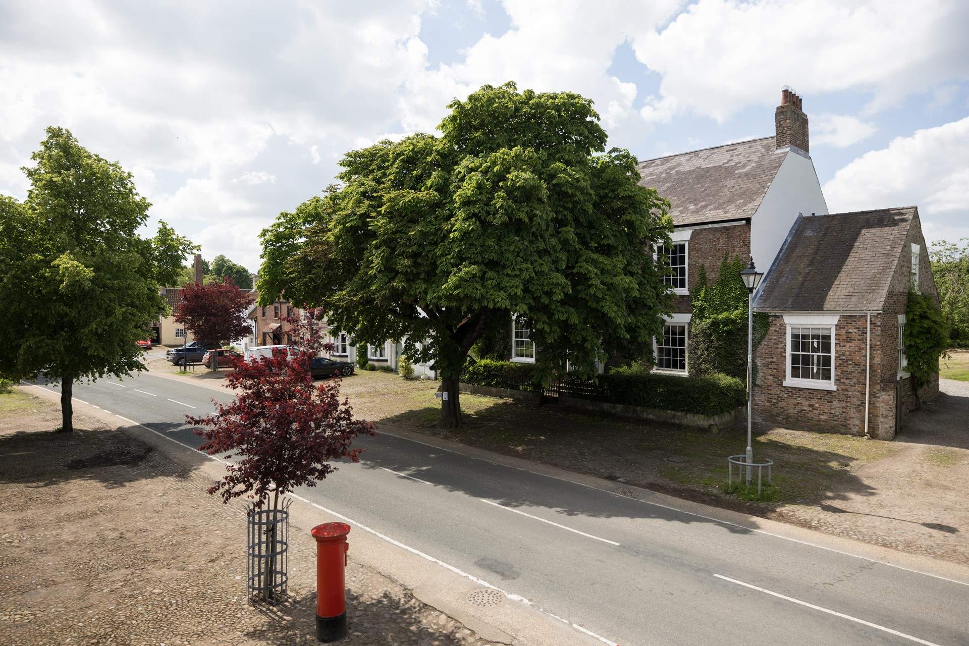 Trees line the pretty street.