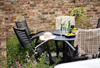 Pretty wildflower borders surround the courtyard garden.