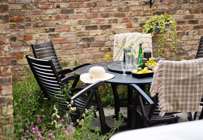 Pretty wildflower borders surround the courtyard garden.