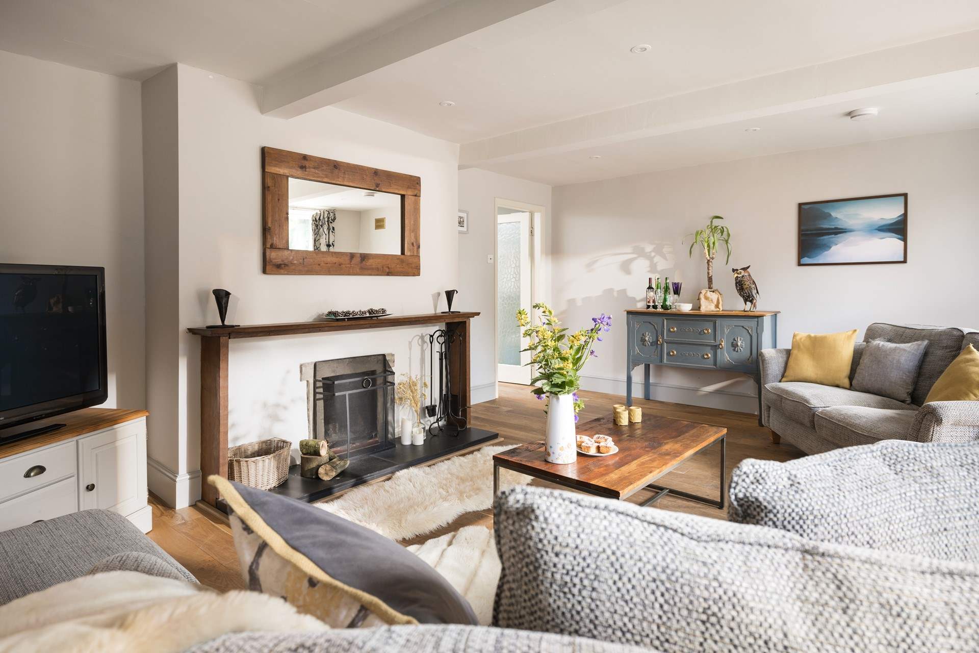 Vintage furniture is showcased in the stylish sitting-room.