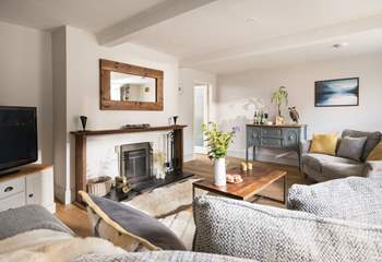 Vintage furniture is showcased in the stylish sitting-room.