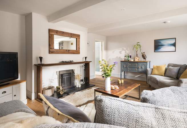 Vintage furniture is showcased in the stylish sitting-room.