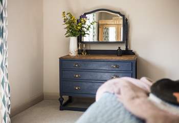 Vintage furniture makes a stylish statement in the bedroom.