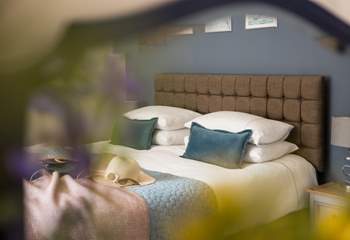 Crisp linens and fluffy pillows entice you into a relaxing slumber.