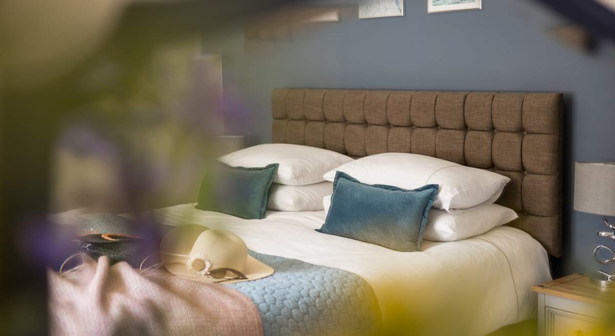 Crisp linens and fluffy pillows entice you into a relaxing slumber.