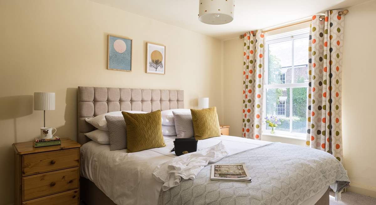 Such a lovely light and sunny bedroom.