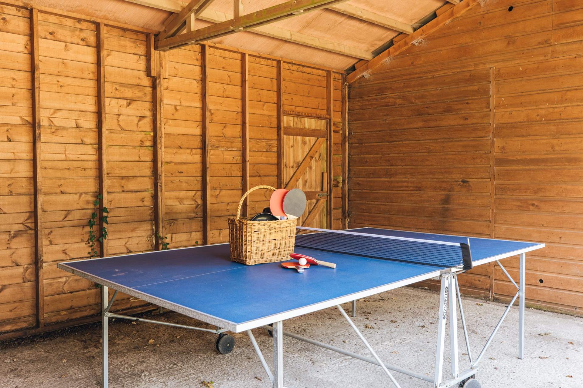 Make use of the table-tennis table in the car port.