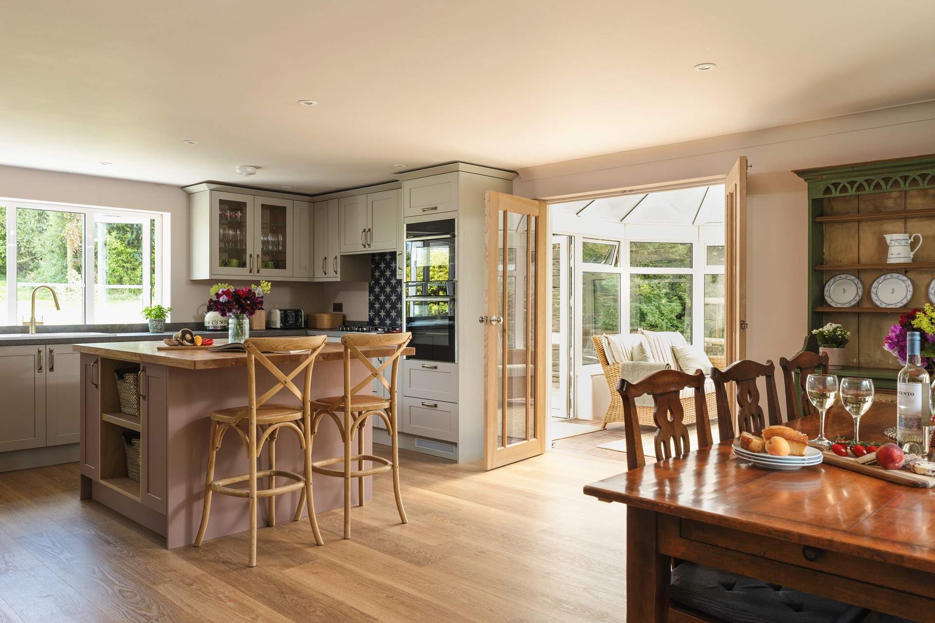 The open plan kitchen/dining-room with doors out to the conservatory is perfect for socialising in.
