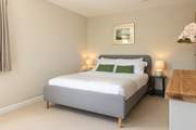 Calming tones ensure total relaxation in bedroom 1...
