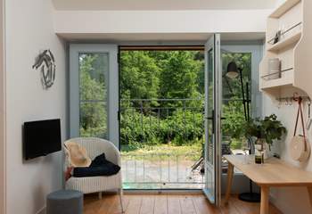 Open up the large door and let the fresh air in. You are moments from the sea.