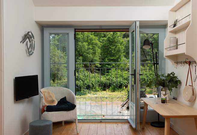 Open up the large door and let the fresh air in. You are moments from the sea.