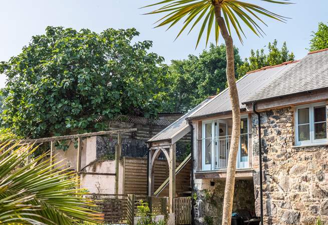 Rose's Loft is a first floor annexe accessed via a short flight of wooden stairs.