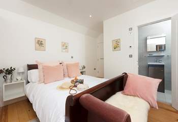 The en suite double bedroom is perfect for a restful night's sleep.