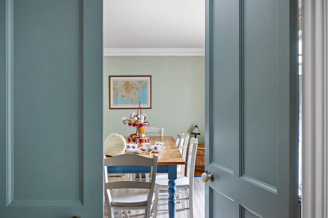 Head across the hall from the sitting-room to discover the dining-room.