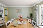 This lovely dining-room floods with light thanks to the patio doors and sits next door to the fabulous kitchen.