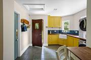 The utility-room - where you can store all your supplies and carry out the washing-up duties! You will also find a large American-style fridge/freezer in addition to the small fridge in the kitchen.