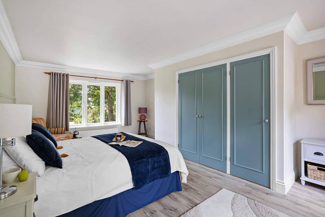 Bedroom 1 is the perfect option for those who are less mobile. You even have a lovely sitting-area with views over the back garden.