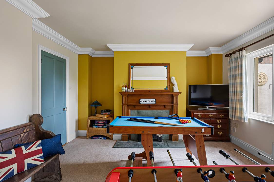 Head back out to the hallway to discover the games-room. The perfect hangout room for young or old, come rain or shine.