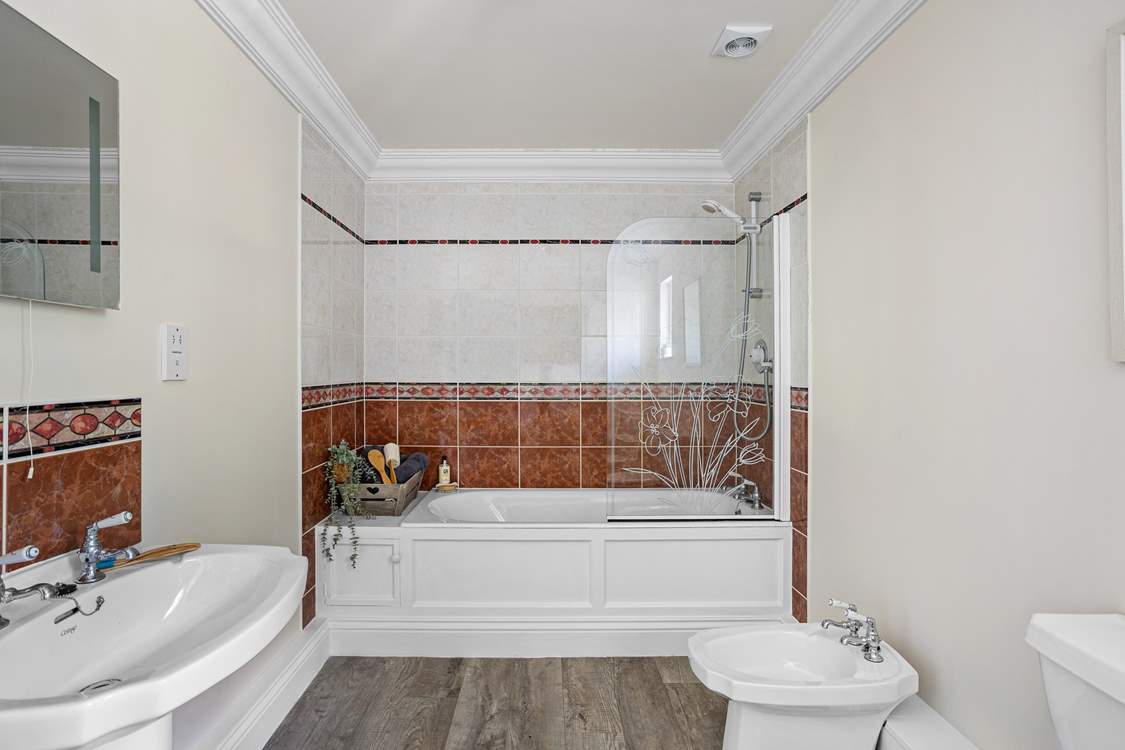 Just outside of bedroom 3 you will find the family bathroom.