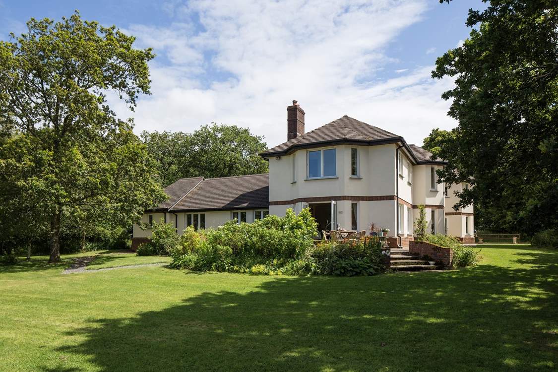 A grand house in a peaceful location.