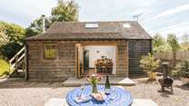 The open plan living area opens out to the delightful garden area.