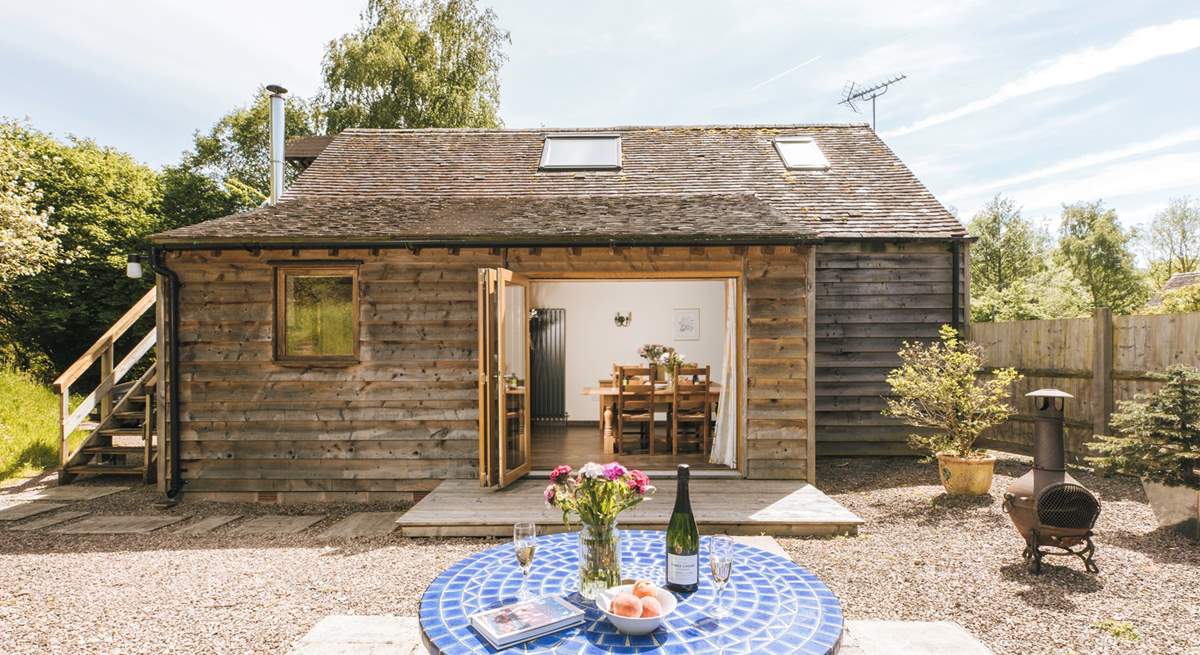 The open plan living area opens out to the delightful garden area.