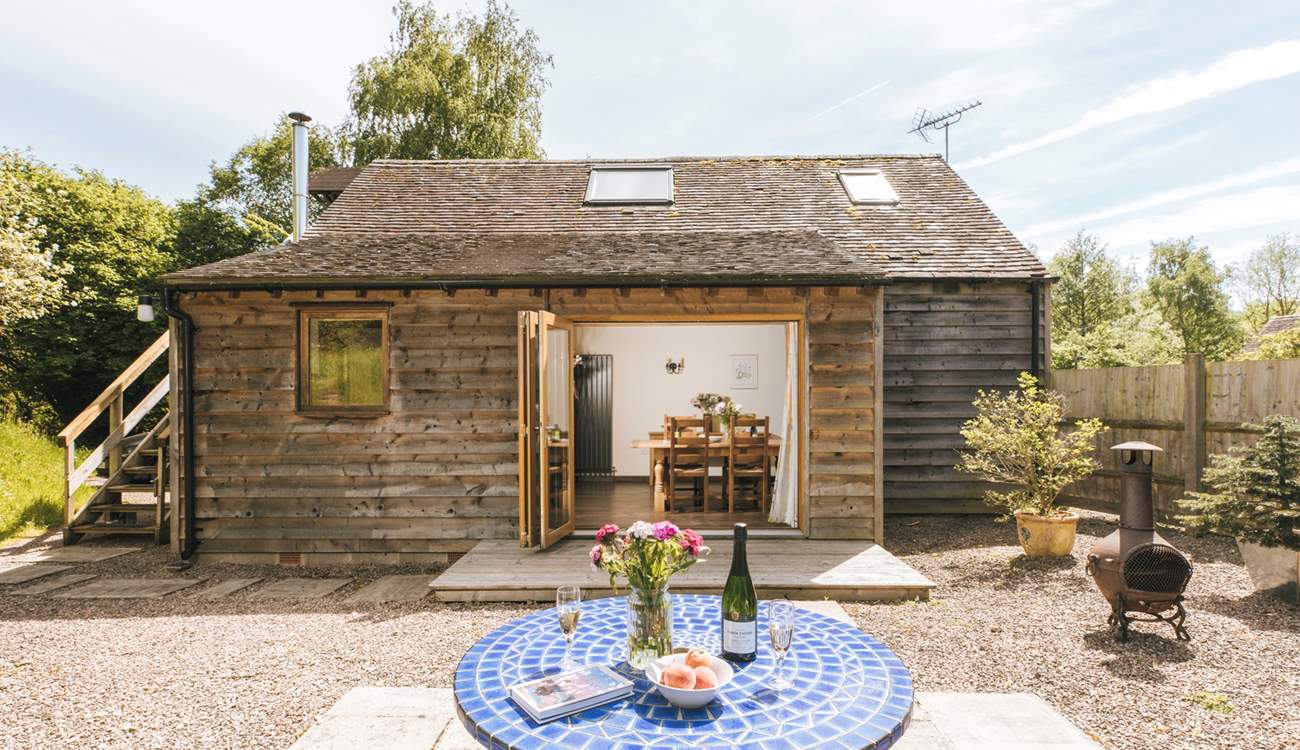 The open plan living area opens out to the delightful garden area.