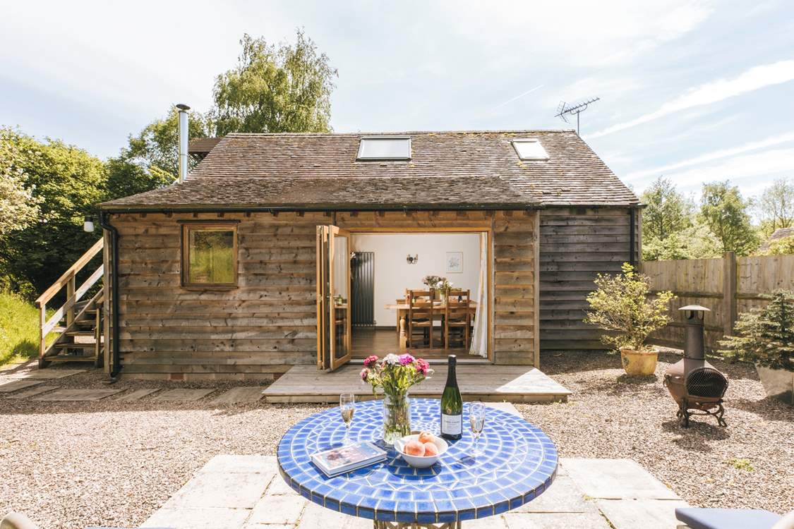The open plan living area opens out to the delightful garden area.