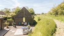 As you look down towards the private garden you can appreciate the idyllic surrounding countryside.