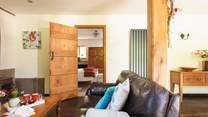 The living area has comfy sofas and a Smart TV to enjoy a movie, or two!