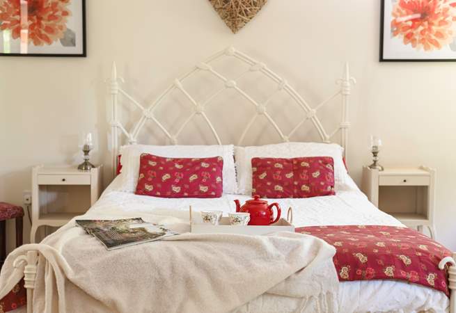 Sumptuous soft furnishings and pretty artwork, create a serene and calm space.