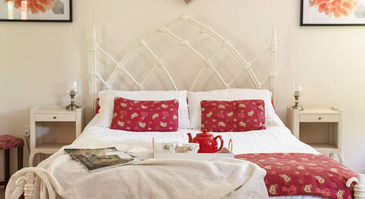 Sumptuous soft furnishings and pretty artwork, create a serene and calm space.