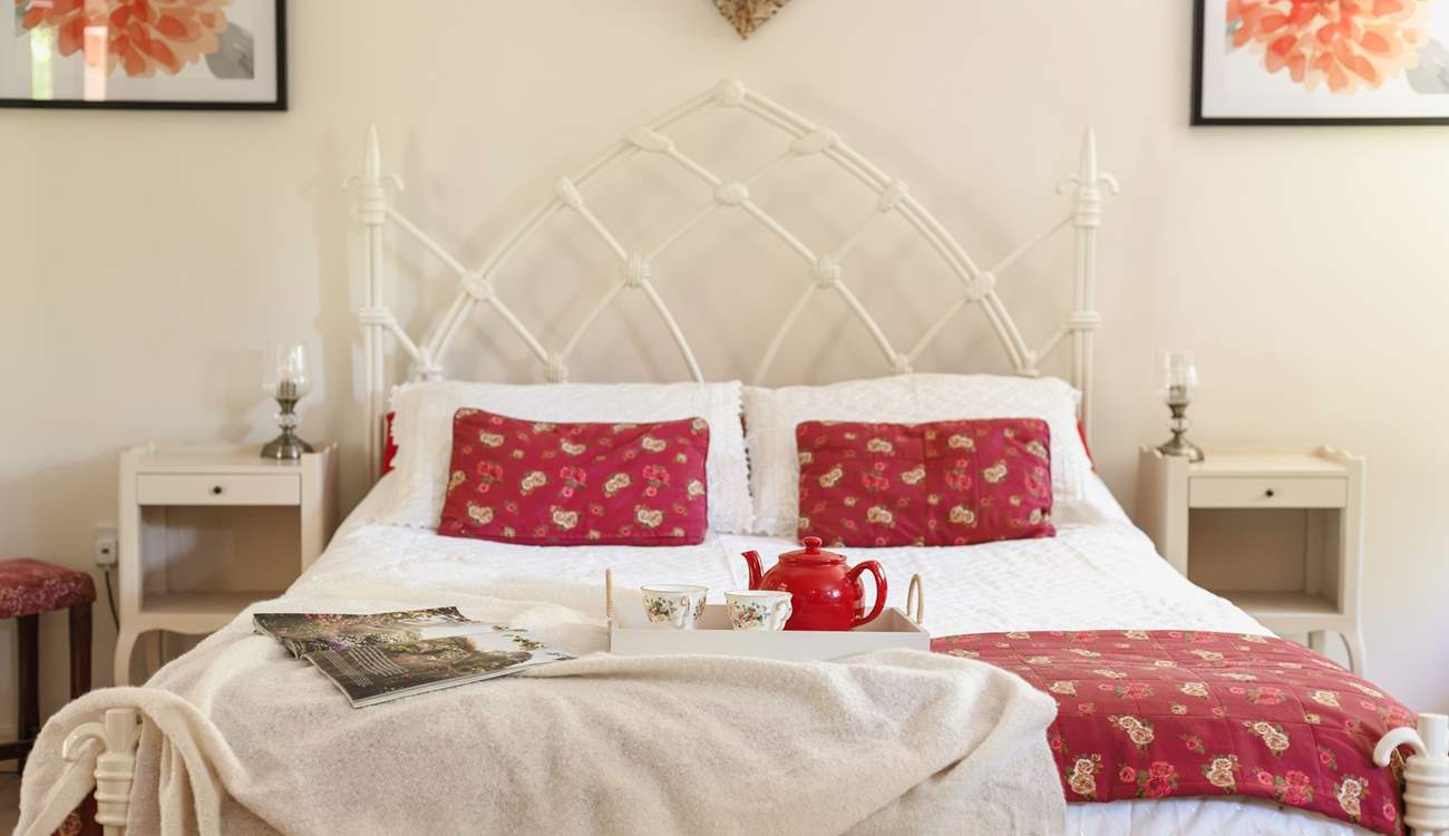 Sumptuous soft furnishings and pretty artwork, create a serene and calm space.